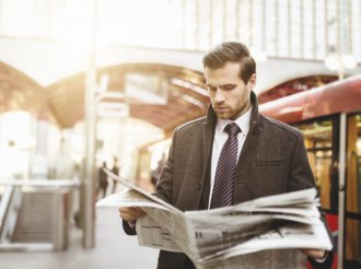 Business man waiting the train on railway station