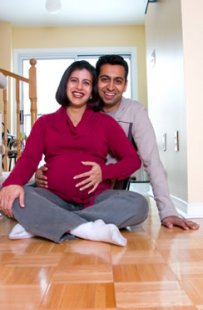 Couple in their new home that they bought with a 20 year mortgage.