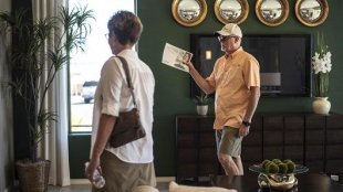 Prospective homebuyers tour a model home in Albuquerque, N.M.